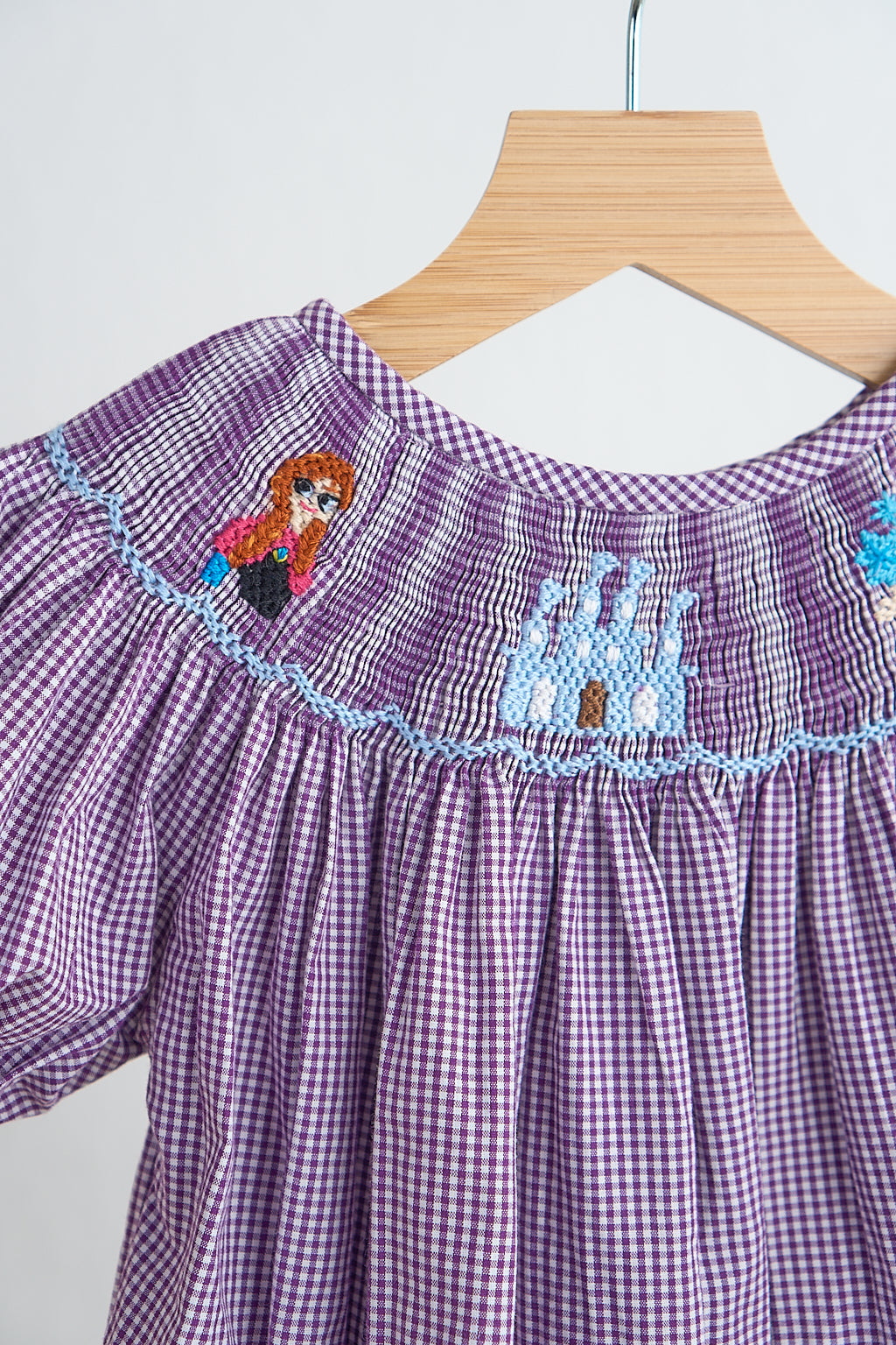 Purple castle hand smocked gingham girl romper